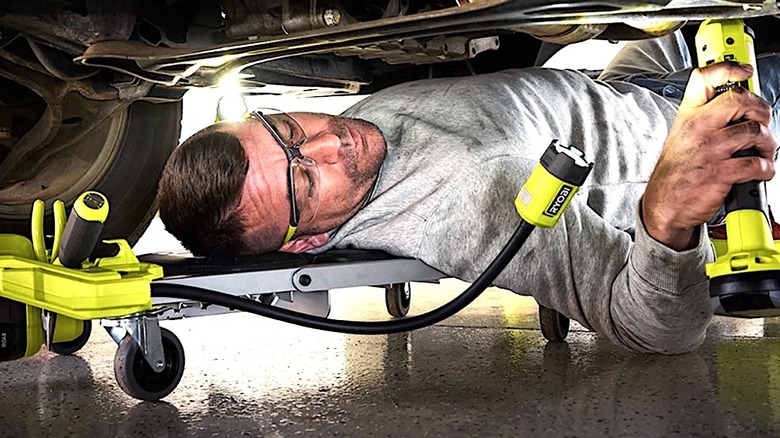 Person using light on Ryobi 18V creeper seat