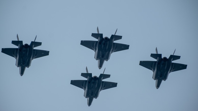 A flight of F-35B Lightning II aircraft in close formation.