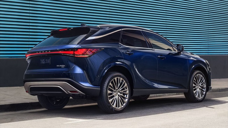 A blue 2025 Lexus RX 350 parked against curb