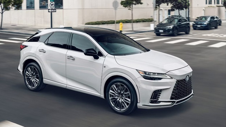 White Lexus RX 350 driving through an intersection