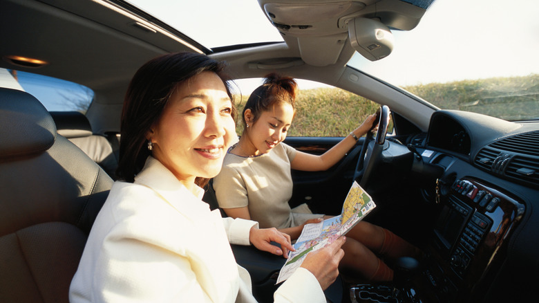 Driver with a front seat passenger, neither wearing seatbelts