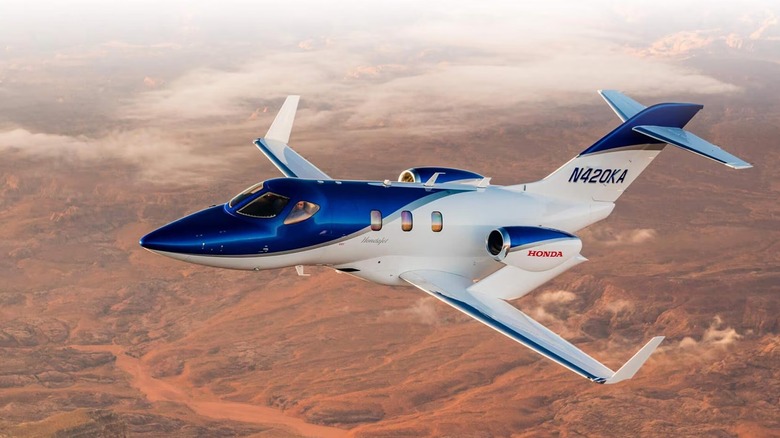 HondaJet aircraft in flight over the desert
