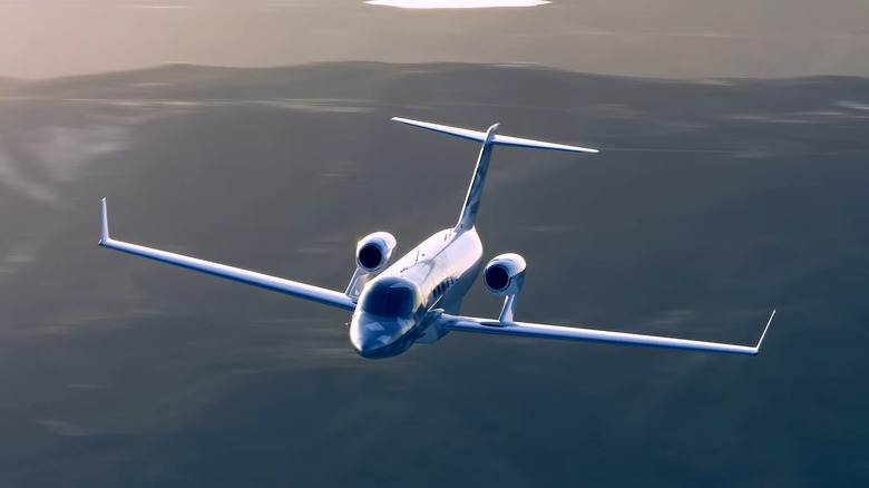 A HondaJet Echelon in flight with innovative over-wing engine configuration visible