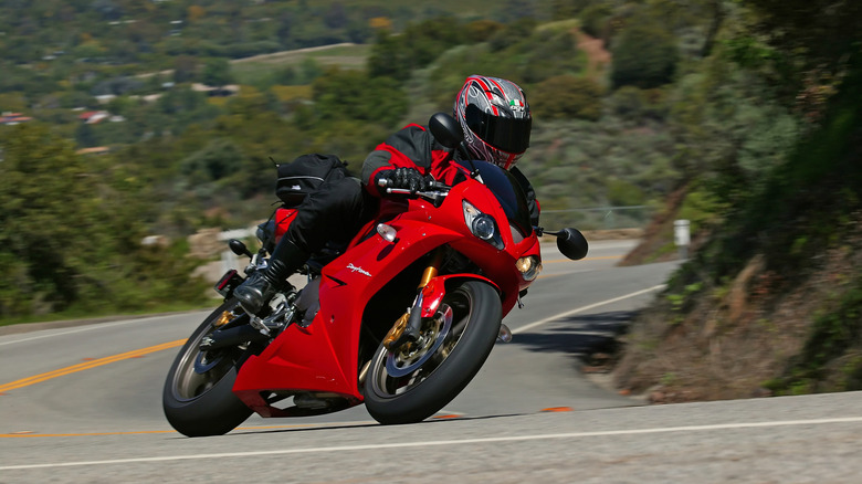 Rider leaning the bike around a curved road