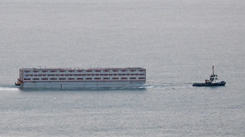 A tugboat towing a Bibly Stockholm barge.