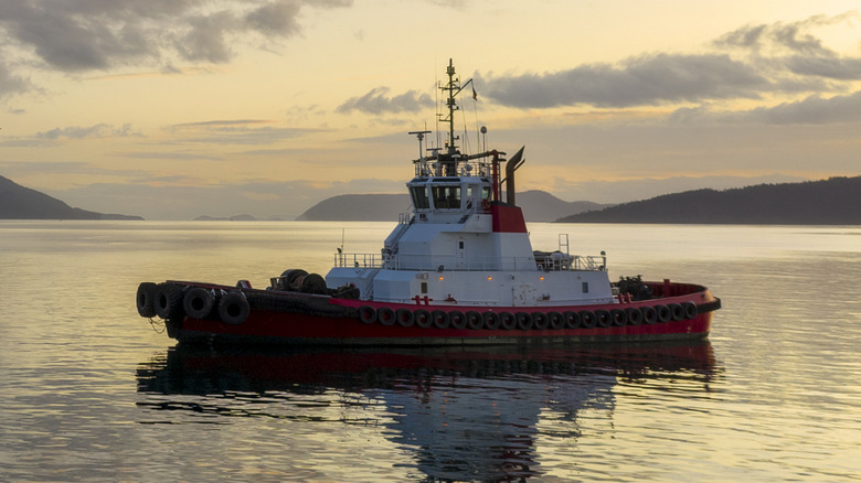 A tugboat in the middle of the sea.