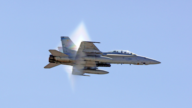 F-18 Hornet jet fighter breaking the sound barrier at 2015 Miramar Air Show in San Diego, California.