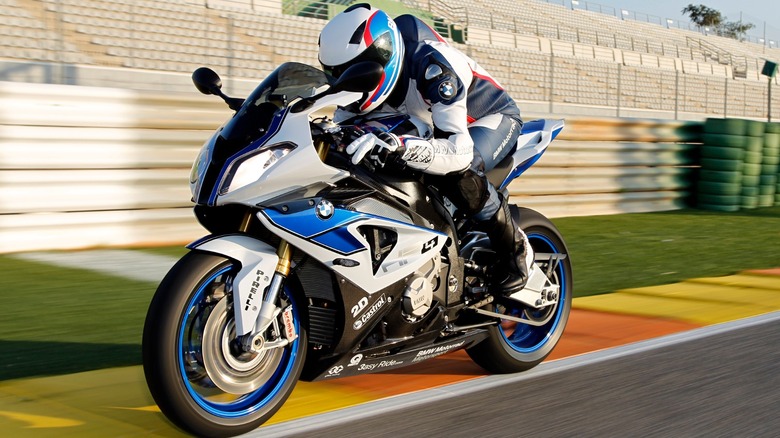 Person riding a 2012 BMW HP4 on track