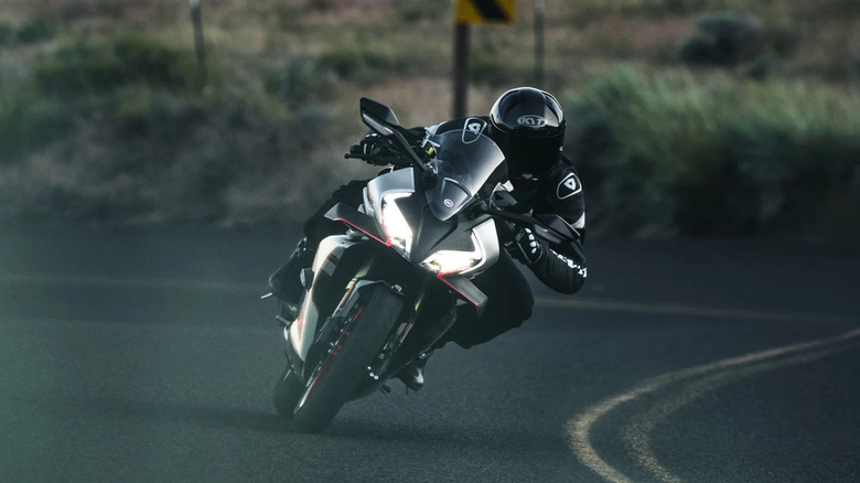 CFMOTO 450SS being ridden on a curving highway