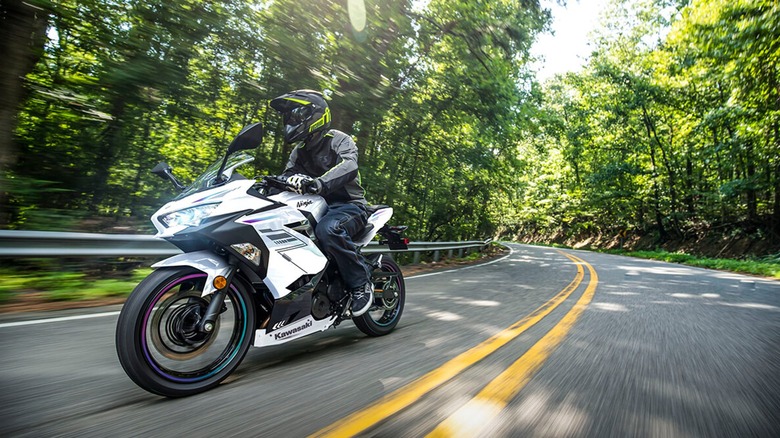 person riding white motorcycle