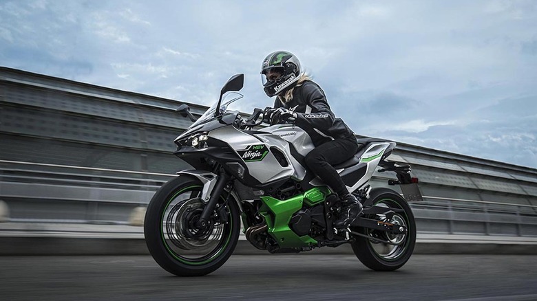 Person riding Kawasaki Ninja 7 Hybrid on a highway