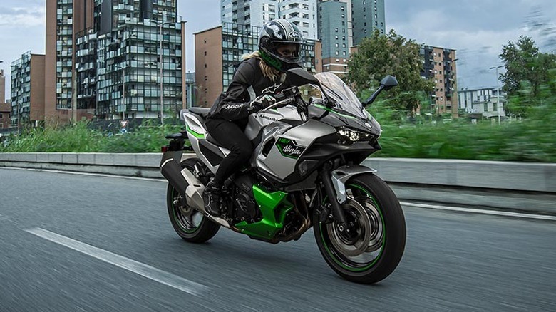 Person riding Kawasaki Hybrid 7 in the city