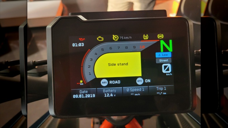 A 2024 KTM Duke 390 motorcycle in a showroom.