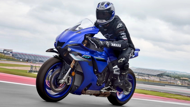 front-side profile view of the 2025 Yamaha YZF-R1 on a closed track