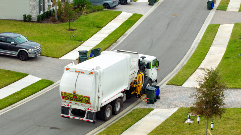 Aerial view of garbage truck in a neighborhood.