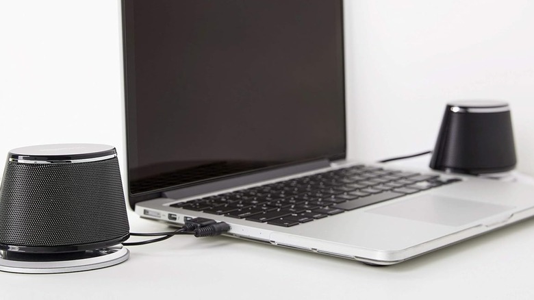 Amazon Basics speakers connected to a laptop.