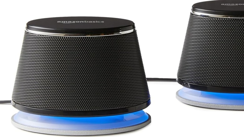 Amazon Basics speakers turned on.