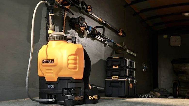 DeWalt backpack sprayer sitting in a storage space