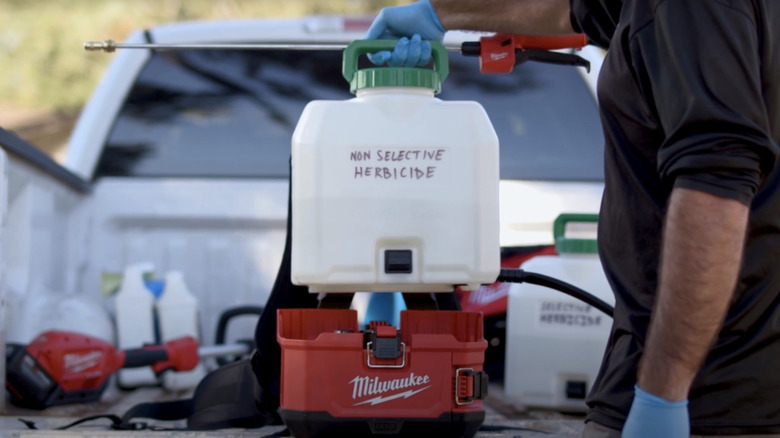 Milwaukee 18V Backpack Sprayer behind car