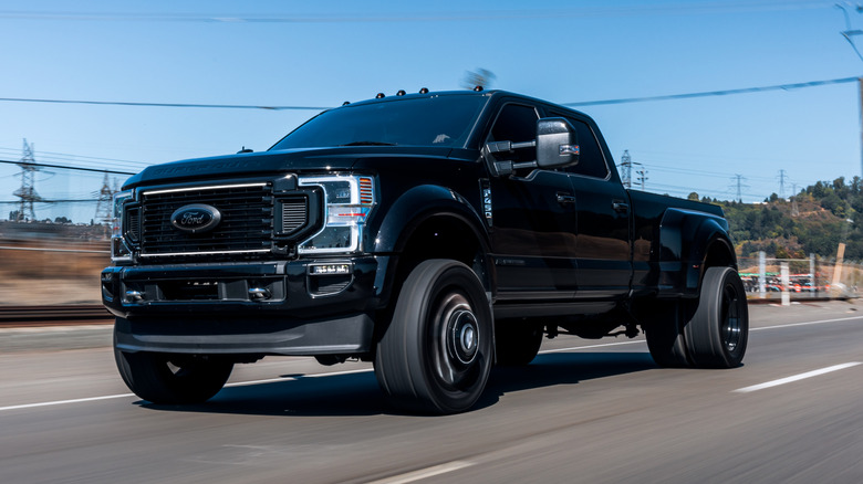 Black Ford F450 driving on the highway