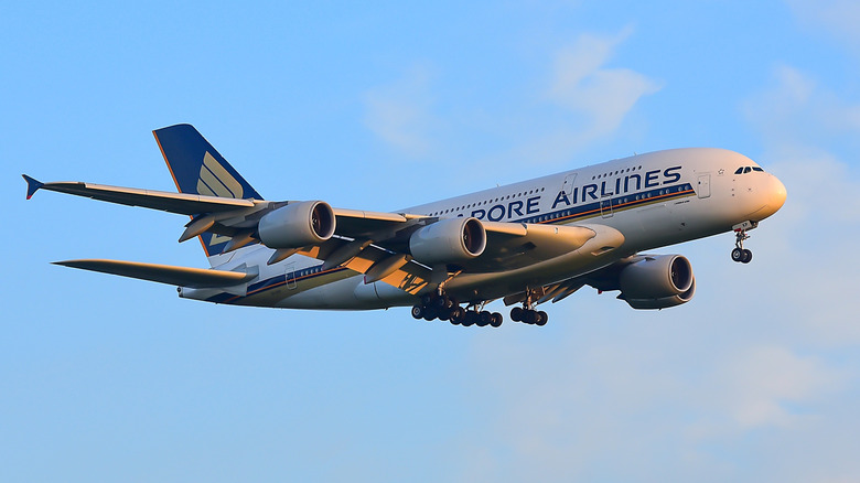 A Singapore Airlines A380 landing at an airport.