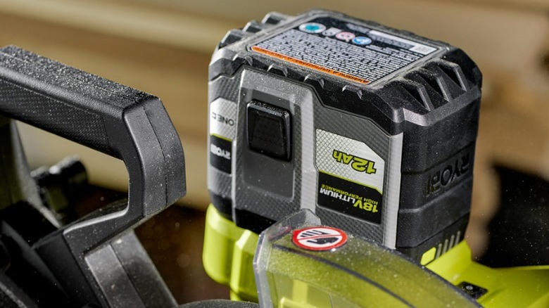 Ryobi 12Ah battery plugged into saw