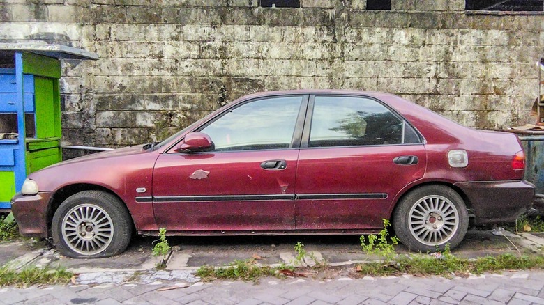 abandoned Honda Civic on roadside
