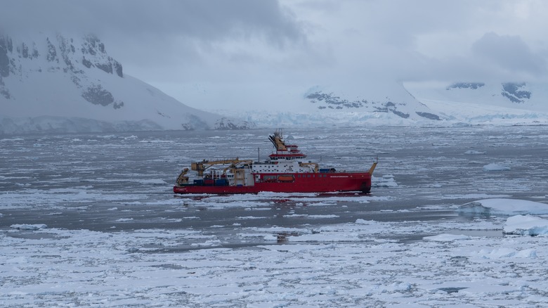 Icebreaker ship sailing through ice covered waters in the Arctic
