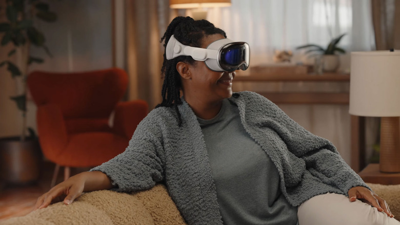 woman wearing Apple Vision Pro VR headset