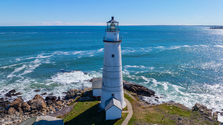 Wide view of the ocean in front of a lighthouse