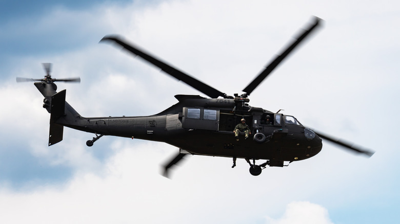 Underside view of a UH-60 Black Hawk helicopter flying