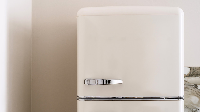 Close-up of a beige refrigerator