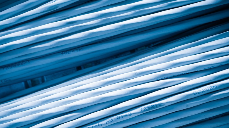 Stacks of white Ethernet cables