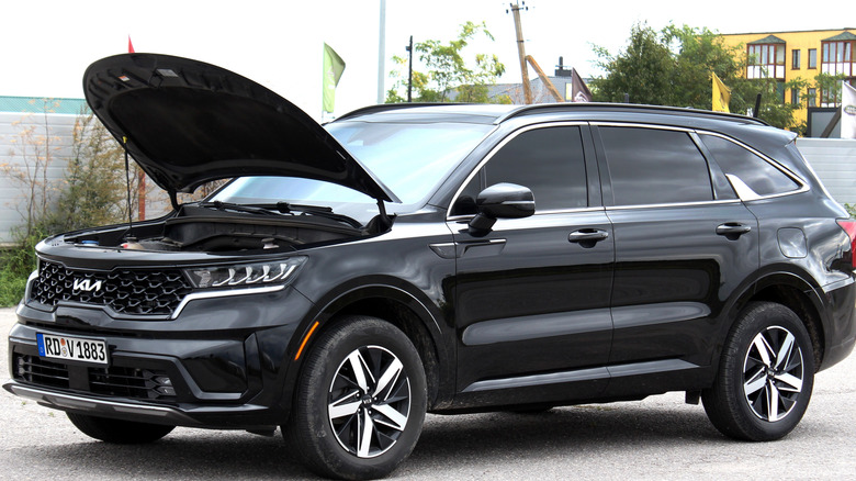 Black KIA Sorento open hood.