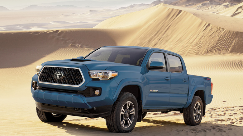 Front-quarter shot of a blue 2019 Toyota Tacoma Sport