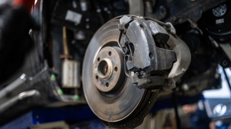 Front wheel hub assembly on car with wheel removed