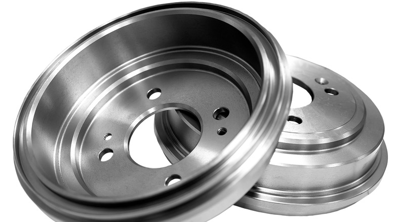 Two drum brakes showing front and rear on white background