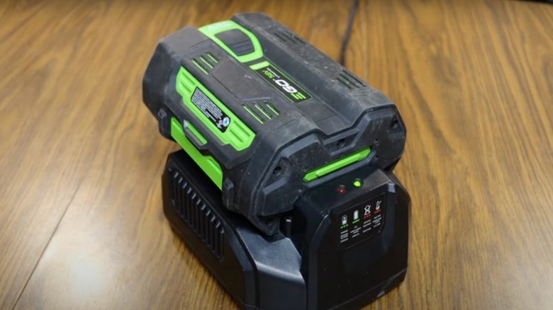 Ego battery on a charger