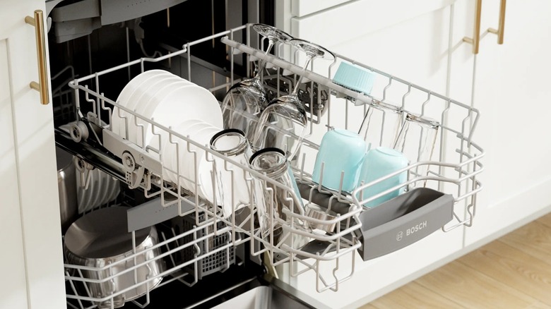 A Bosch dishwasher rack full of clean dishes.