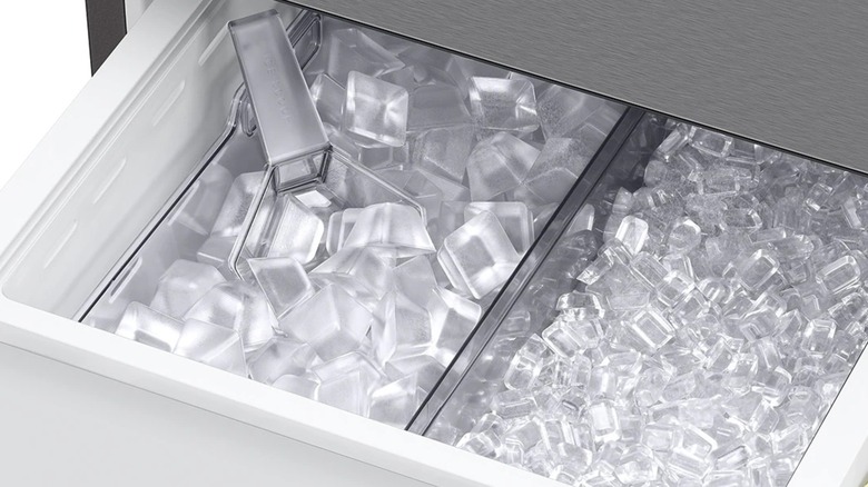 Two full ice trays inside a Samsung refrigerator.