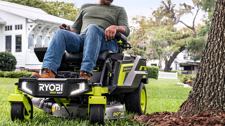 Man using Ryobi lawn mower