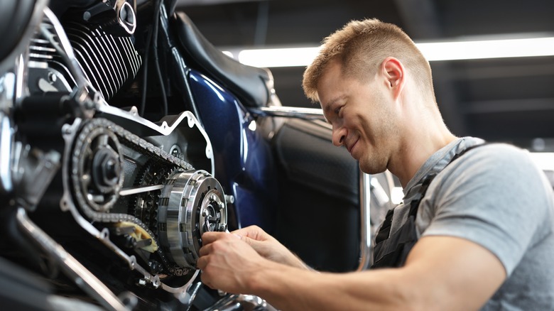 Male mechanik repair motorcycle