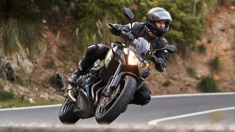 A man riding a performance-bike around a corner