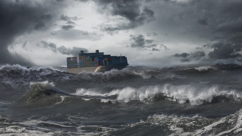 Cargo ship sailing across the ocean in bad weather