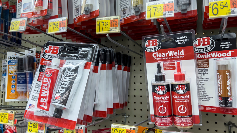 Close-up of J-B Weld products displayed on a store shelf