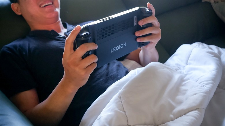 A boy using his Lenovo Legion Go.