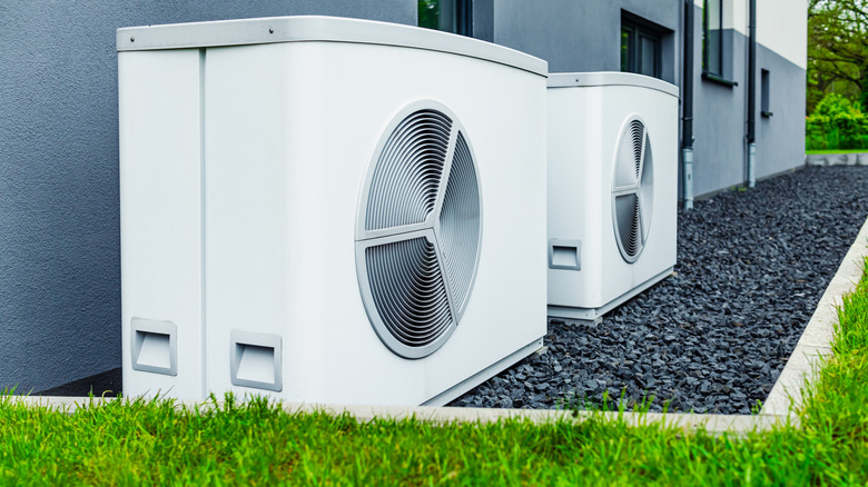 Pictures of new HVAC heat pump systems outside of a home