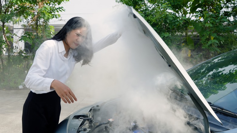 smoke pouring out of car engine