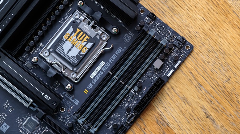Close up of an Asus TUF motherboard with an AM5 socket