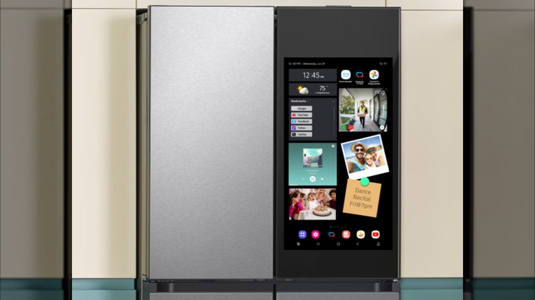 A darker colored Smasung refrigerator, screen full of widgets shown